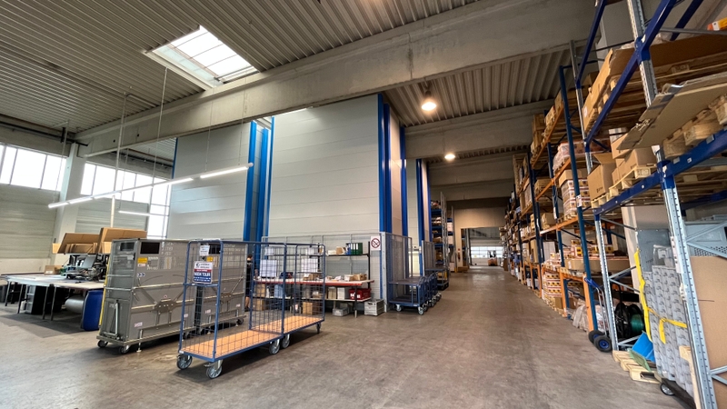 Fork lift in a high-bay warehouse